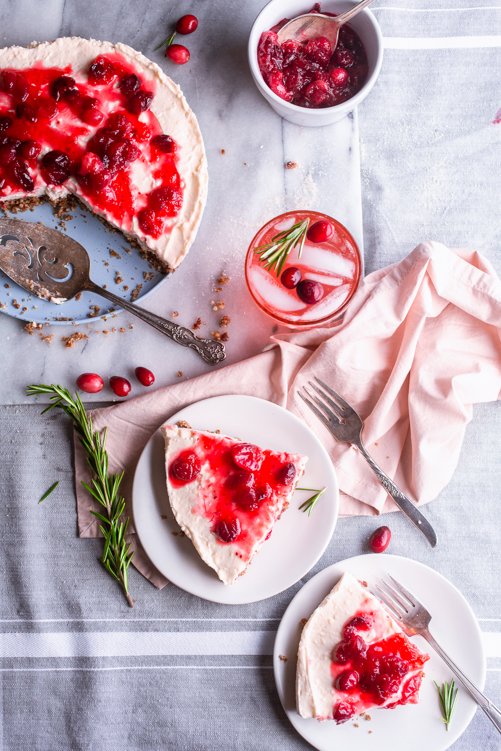 Cranberry cheesecake Tart, 2 plates and 1 glass of cranberry spritzer
