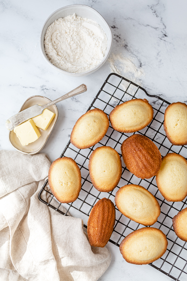 Overhead shot of madeleines on cookie rack - I shot this image as part of a personal project. I will be using this image as an instagram post, in my stories, on Pinterest, in the proposals I send to my clients and in my online portfolio.